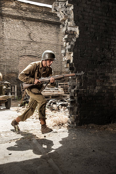 istock WWII Soldier Running Into Building Under Attack 483725906