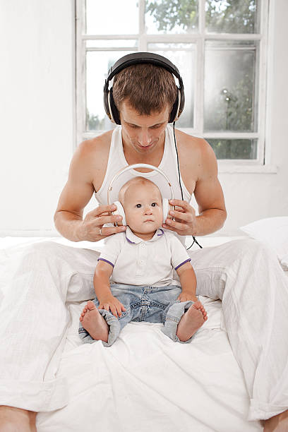 istock young father with his nine months old som on the 483726334