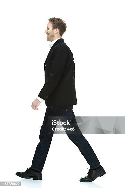 Smiling Smart Casual Man Walking Stock Photo - Download Image Now - Men, Side View, Walking