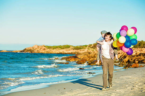 istock Happy father and son having great time on the beach 483732254
