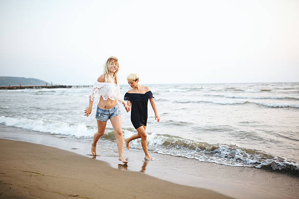 istock Best friends running at beach 483732290