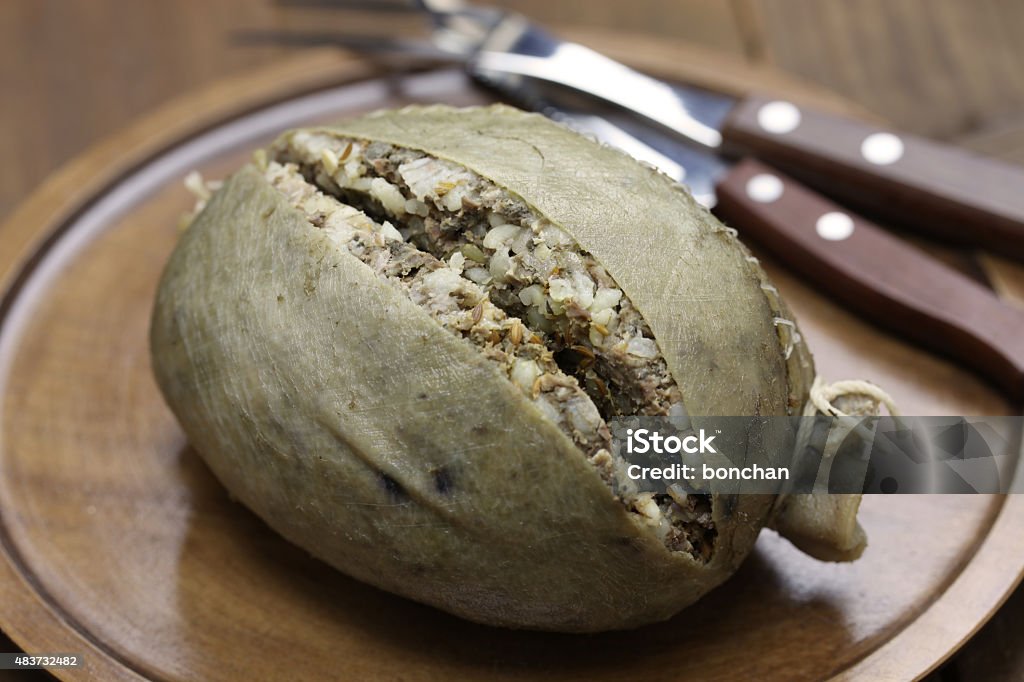 homemade haggis, scotland food homemade haggis, scotland food isolated on wooden background Haggis Stock Photo