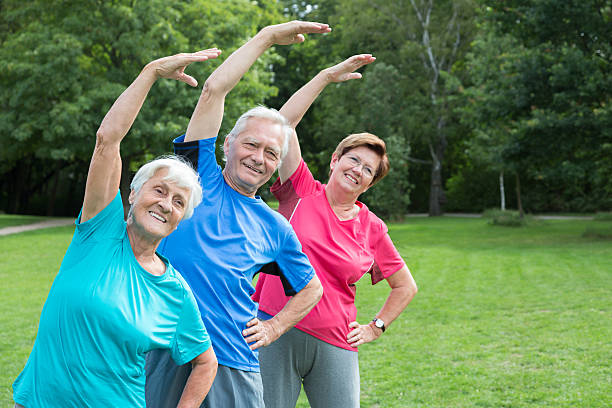 istock Seniors - gymnastics in the park 483735396