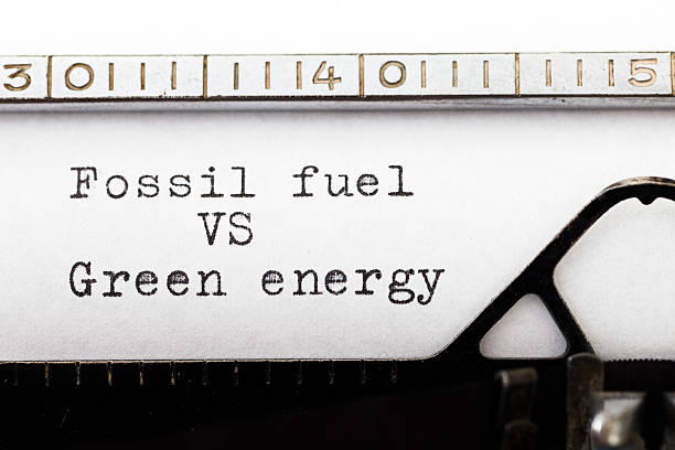 istock Fossil fuel vs green energy written on old typewriter. 483738766