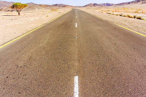 istock Road through Sahara desert in Sudan. 483740166