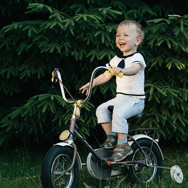 istock little happy boy on bike 483740816
