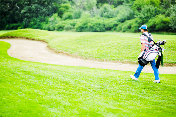 istock Golfer carrying his equipment 483741482