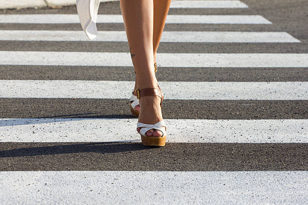 istock crossing over pedestrian crossing towards camera 483748314