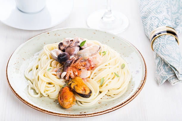 istock Seafood Spaghetti with Prawns, Scallops, Mussels, Calamari and Tomato Sauce 483748430