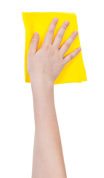istock hand with yellow washing rag isolated on white 483748996