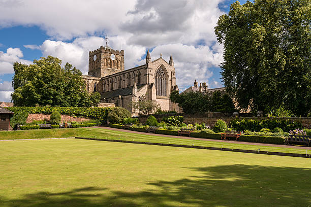 Sunny day at Hexham Abbey The historic Market Town of Hexham sits in the Tyne Valley in Northumberland. The skyline is dominated by the Abbey monastery religion spirituality river stock pictures, royalty-free photos & images