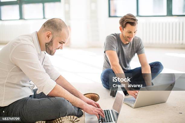 Two Young Men Working On Their Start Up Stock Photo - Download Image Now - Design Professional, Adult, Adults Only