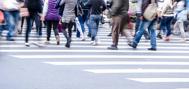 istock People walking on big city street 483751343