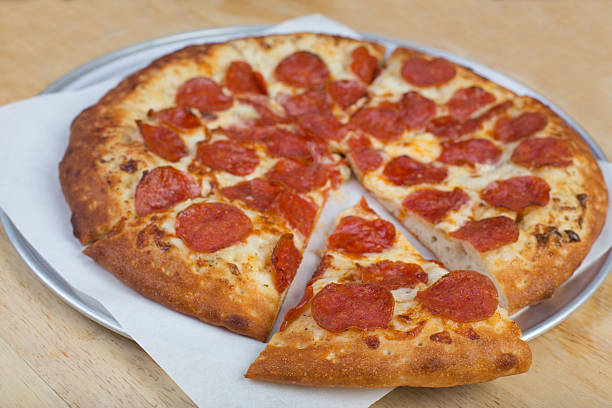 istock Pepperoni pizza on white sauce pre cut 483751499