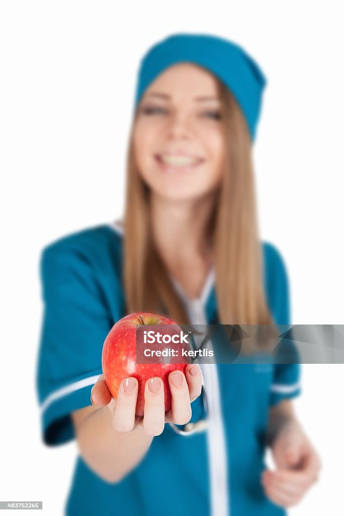 nurse and an apple nurse and an apple (healthy food) Adult Stock Photo
