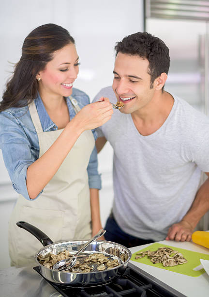 Couple cooking together at home