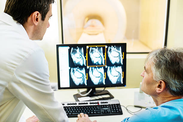 istock Doctors examining X-ray images. 483752639