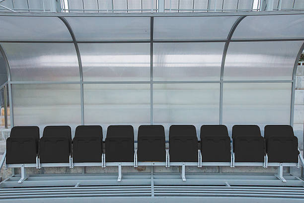 istock Black reserve and staff coach bench in sport stadium 483753589