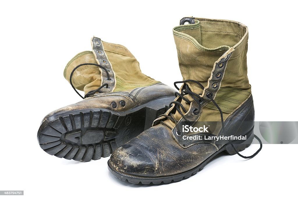 Vietnam Jungle Boots Close up view of a US Army jungle boots that were actually worn in Vietnam.   The jungle boots are isolated on white and are the DMS spike protective version. Vietnam War Stock Photo