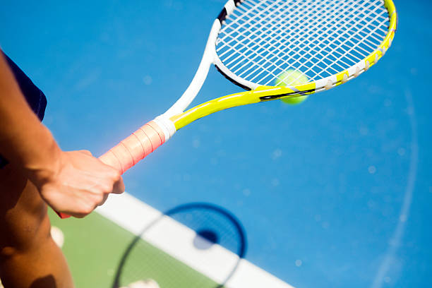 istock Closeup of a player holding the racquet warming up 483755200