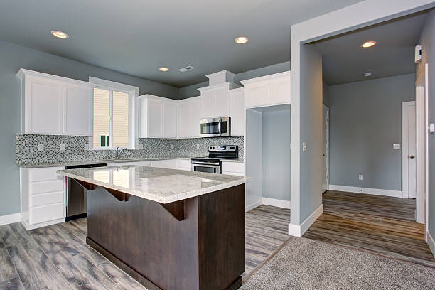 istock Unique kitchen with gray hardwood floor. 483755260