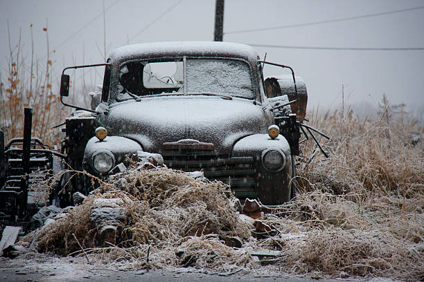 Old Broken-Down Truck in a Snow Storm stock photo