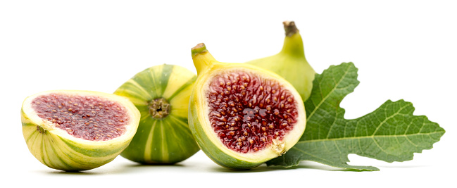 purple fig isolated on the dark wooden background close up