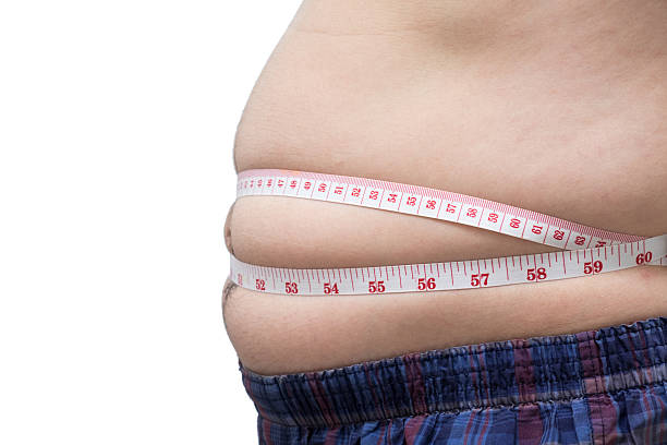 istock Fat asian man use waist measure for his belly 483762818