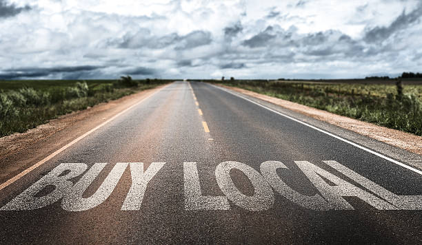 istock Buy Local written on rural road 483763228