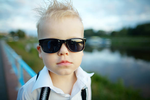 istock little gentleman with sunglasses outdoors 483763718
