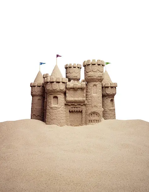 Sandcastle against white background to allow "dropping in" of your own sky
