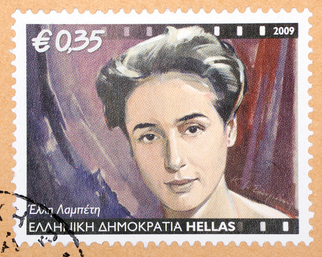 Greek stamps on letter paper background.