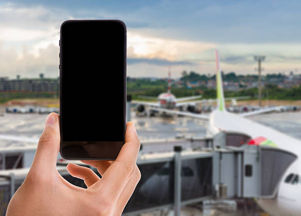 istock Phone with black screen on airport background 483767518