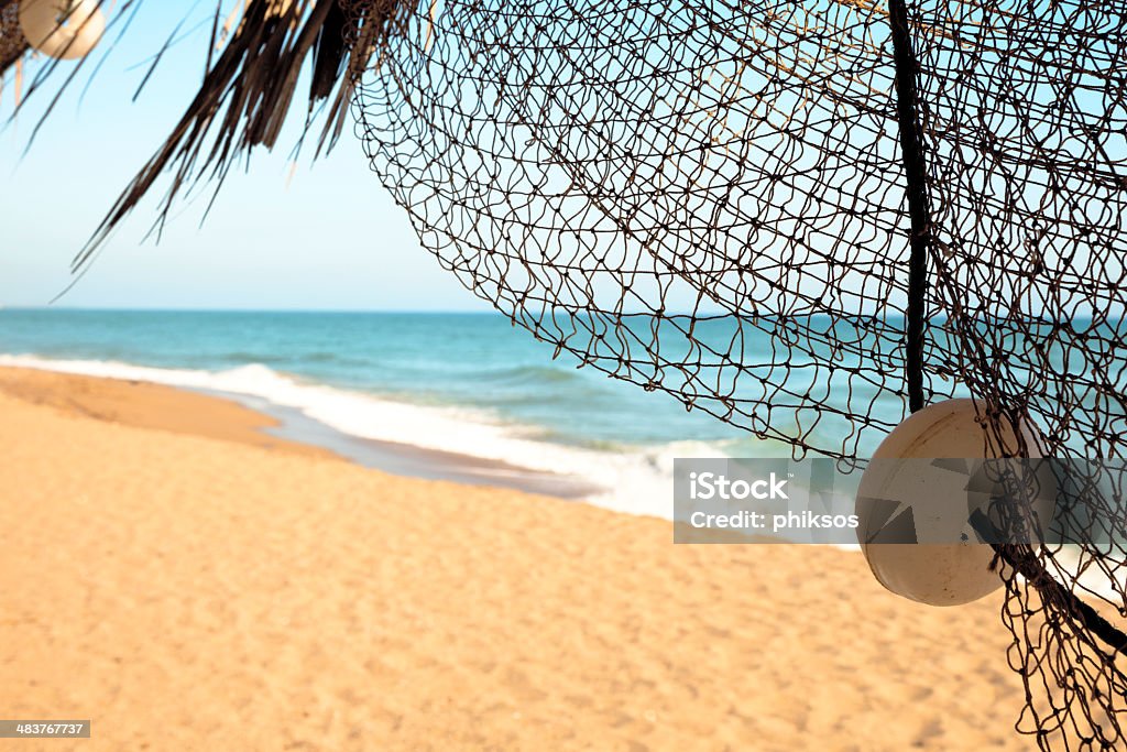 Vue de pêcheurs de net de soleil et de la mer - Photo de Marée libre de droits