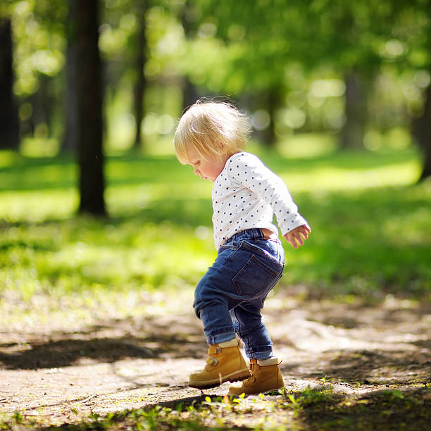 istock Toddler boy walking in the park 483767948
