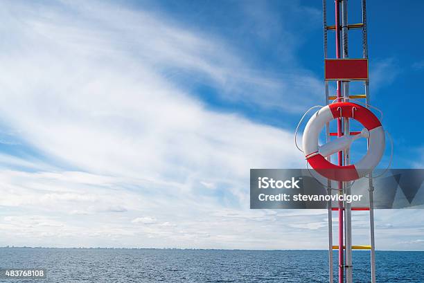 Lifebuoy Life Preserver Bu The Seashore Stock Photo - Download Image Now - 2015, Assistance, Beach