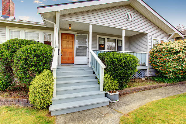 istock Small American home with light exterior and white trim. 483768416
