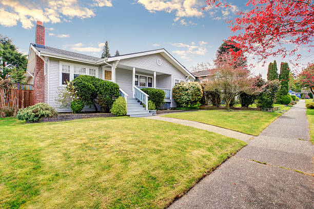 istock Small American home with light exterior and white trim. 483768422