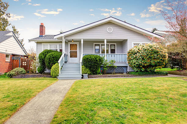 istock Small American home with light exterior and white trim. 483768426
