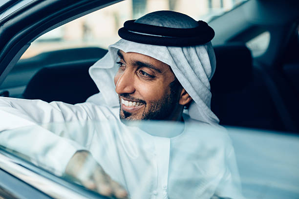Emirati Businessman in a car stock photo