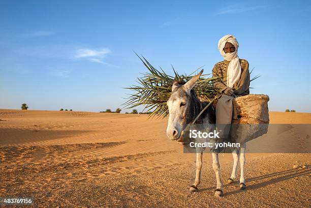 African Nomad Man Stock Photo - Download Image Now - Donkey, Desert Area, Men