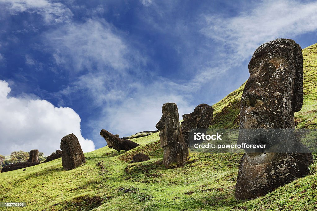 Rano Raraku Quarry - Easter Island Rano Raraku Quarry is the site on the side of a dormant volcano, where all the moai on the island were carved. It was a working quarry on the island all the way to the early 18th century. 397 moai still remain on the site at various stages of completion. Ancient Stock Photo