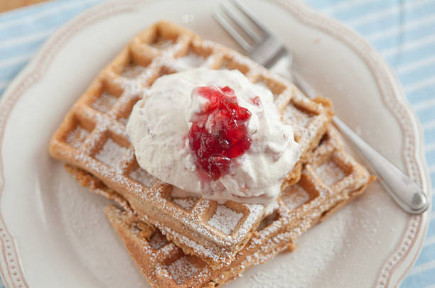 istock Home made waffles with jam and whipped cream 483771425