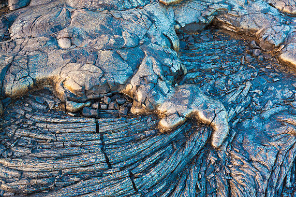 lava swirl fond - ridé surface solide photos et images de collection