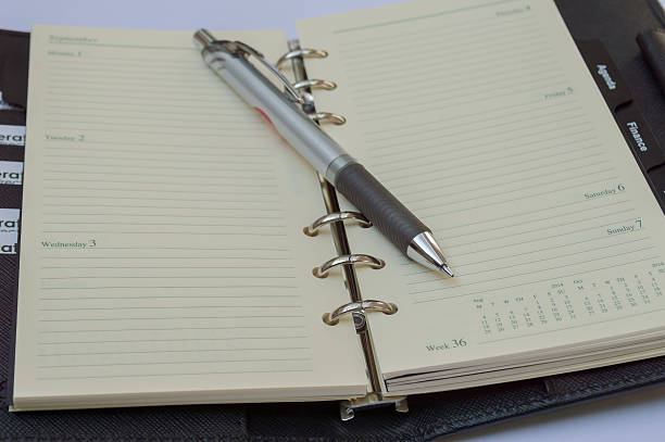 istock Leather open notebook and pen in the White background 483773727