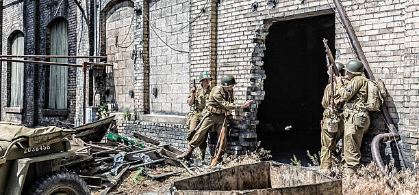 istock WWII US Army Soldier Throwing Hand Grenade Into Building 483773966