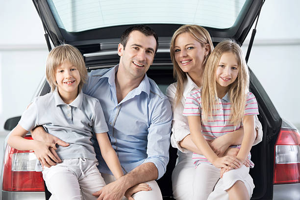 istock Smiling family in a showroom. 483774167