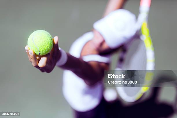 Beautiful Female Tennis Player Serving Stock Photo - Download Image Now - 2015, Above, Active Lifestyle