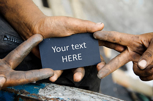 Dirty hands holding a card