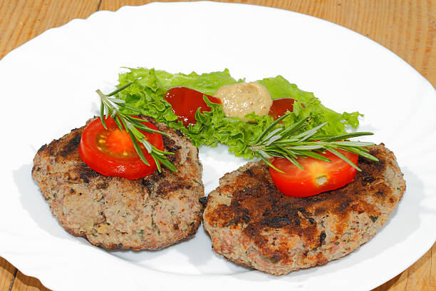 istock Grilled beef patties, spicy sauces, plates 483779990